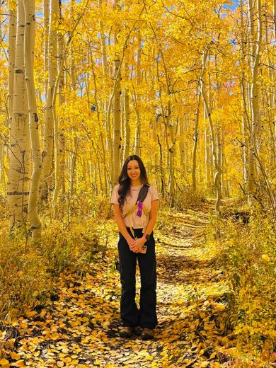 Dr. Long on a forest path in fall