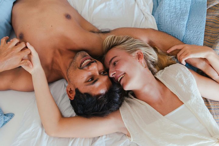 Smiling couple looking down